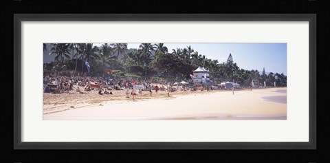 Framed Tourists on the beach, North Shore, Oahu, Hawaii, USA Print