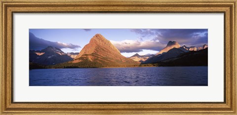 Framed Sunlight falling on mountains at the lakeside, Swiftcurrent Lake, Many Glacier, US Glacier National Park, Montana, USA Print