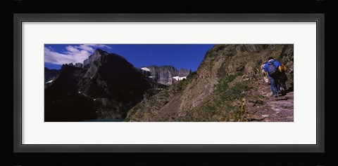 Framed Hikers hiking on a mountain, US Glacier National Park, Montana, USA Print