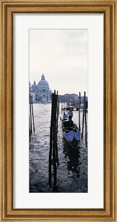 Framed Gondolier in a gondola with a cathedral in the background, Santa Maria Della Salute, Venice, Veneto, Italy Print
