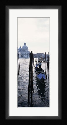 Framed Gondolier in a gondola with a cathedral in the background, Santa Maria Della Salute, Venice, Veneto, Italy Print