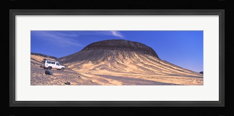 Framed SUV moving in a desert, Black Desert, Bahariya Oasis, Egypt Print