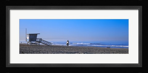 Framed Rear view of a surfer on the beach, Santa Monica, Los Angeles County, California, USA Print
