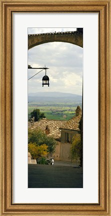 Framed Umbrian countryside viewed through an alleyway, Assisi, Perugia Province, Umbria, Italy Print