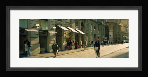 Framed Cyclists and pedestrians on a street, City Center, Florence, Tuscany, Italy Print