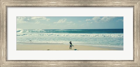 Framed Surfer standing on the beach, North Shore, Oahu, Hawaii Print