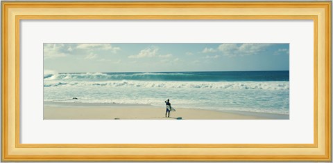 Framed Surfer standing on the beach, North Shore, Oahu, Hawaii Print