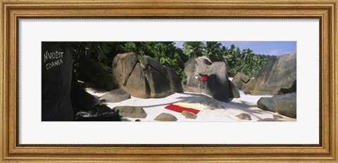Framed Nudist corner written on a rock on the beach, Mahe Island, Seychelles Print