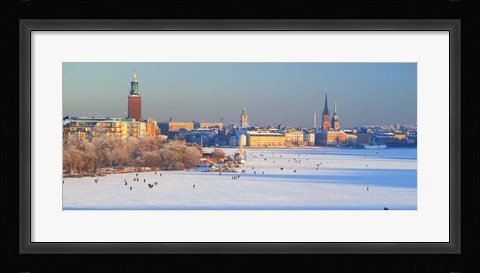 Framed People strolling across frozen Riddarfjarden, Riddarholmen, Stockholm, Sweden Print