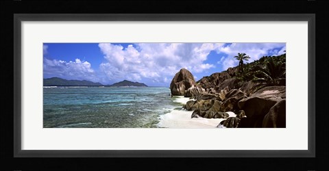 Framed Rock formations on the beach on Anse Source d'Argent beach with Praslin Island in the background, La Digue Island, Seychelles Print