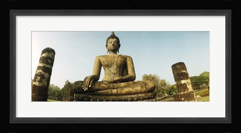 Framed Low angle view of a statue of Buddha, Sukhothai Historical Park, Sukhothai, Thailand Print