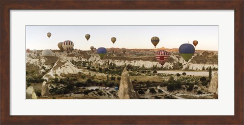 Framed Mulit colored hot air balloons at sunrise over Cappadocia, Central Anatolia Region, Turkey Print