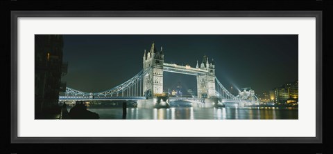 Framed Low angle view of a bridge lit up at night, Tower Bridge, London, England Print
