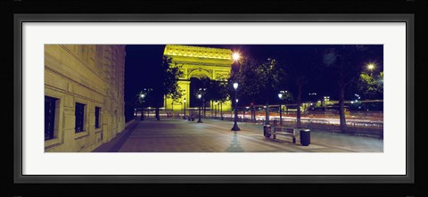 Framed France, Paris, Arc de Triomphe lit up at night Print