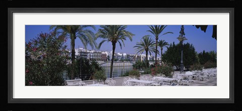 Framed Sidewalk cafe at the riverside, Guadalquivir River, Seville, Spain Print