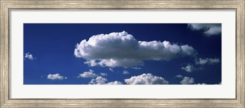 Framed Fluffy clouds in blue sky Print