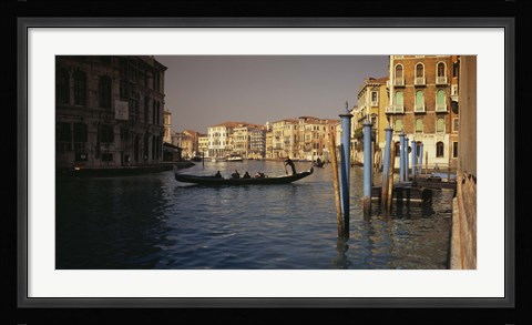 Framed Tourists sitting in a gondola, Grand Canal, Venice, Italy Print