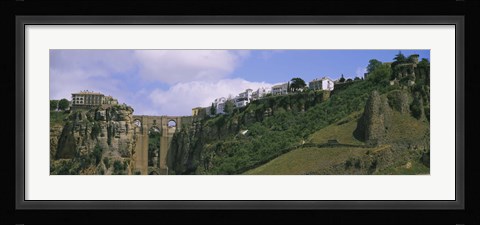 Framed Low angle view of a town, Tajo Bridge, Rio Guadalevin Gorge, Serrania De Ronda, Ronda, Andalusia, Spain Print