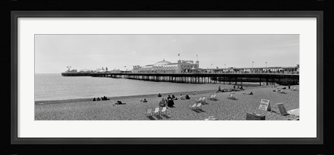 Framed Tourists on the beach, Brighton, England Print