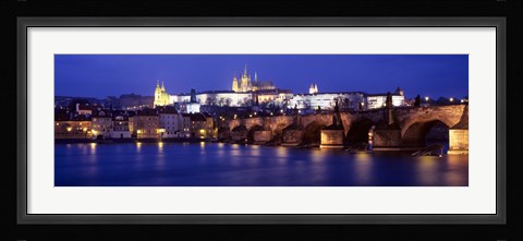 Framed Bridge across a river lit up at night, Charles Bridge, Vltava River, Prague, Czech Republic Print