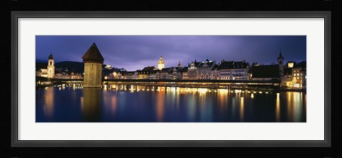 Framed Buildings lit up at dusk, Chapel Bridge, Reuss River, Lucerne, Switzerland Print