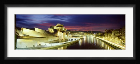 Framed Buildings lit up at dusk, Guggenheim Museum Bilbao, Bilbao, Vizcaya, Spain Print