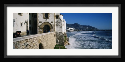 Framed Tourists in a church beside the sea, Sitges, Spain Print