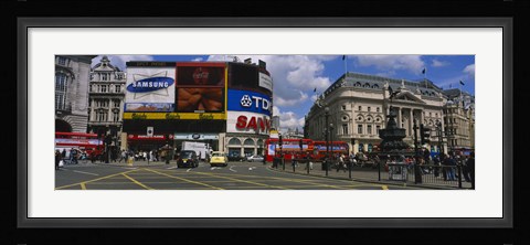Framed Commercial signs on buildings, Piccadilly Circus, London, England Print