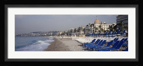Framed Empty lounge chairs on the beach, Nice, French Riviera, France Print