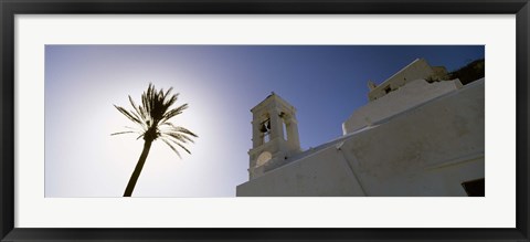 Framed Low angle view of a palm tree near a church , Ios, Cyclades Islands, Greece Print