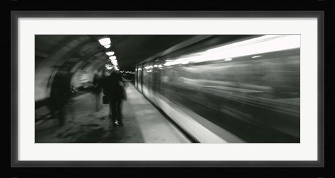 Framed Subway train passing through a subway station, London, England Print