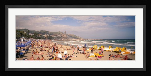 Framed Tourists on the beach, Sitges, Spain Print
