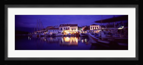 Framed Greece, Cephalonia, Light illuminated on harbor and outdoors cafe Print