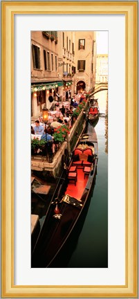 Framed Gondolas moored outside of a cafe, Venice, Italy Print