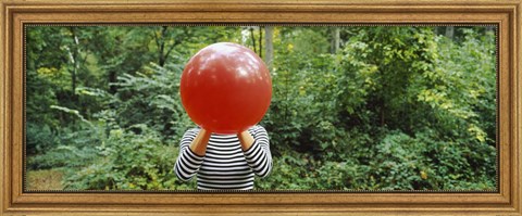 Framed Woman blowing a balloon, Germany Print