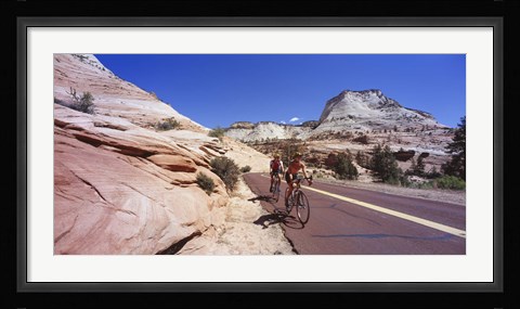 Framed Two people cycling on the road, Zion National Park, Utah, USA Print