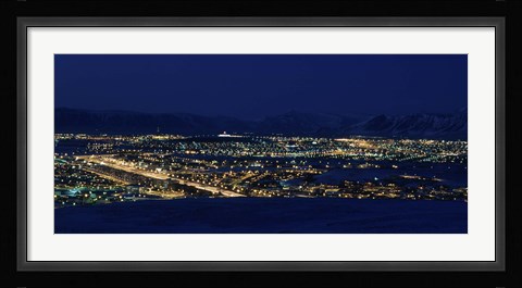 Framed High angle view of city lit up at night, Reykjavik, Iceland Print