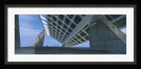 Framed Four people under a structure, Barcelona, Catalonia, Spain Print