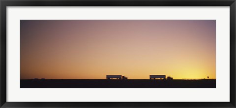 Framed Silhouette of two trucks moving on a highway, Interstate 5, California, USA Print