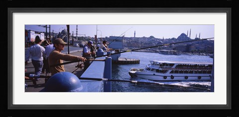 Framed Side profile of fishermen fishing in a river, Galata Bridge, Istanbul, Turkey Print