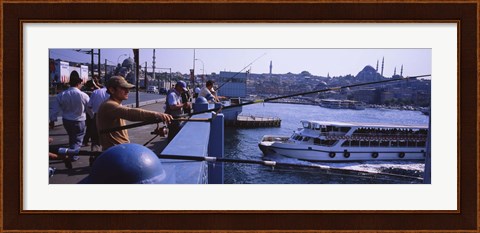 Framed Side profile of fishermen fishing in a river, Galata Bridge, Istanbul, Turkey Print