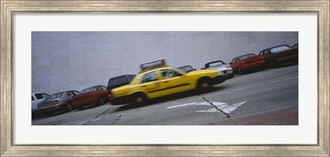 Framed Taxi running on the road, San Francisco, California, USA Print