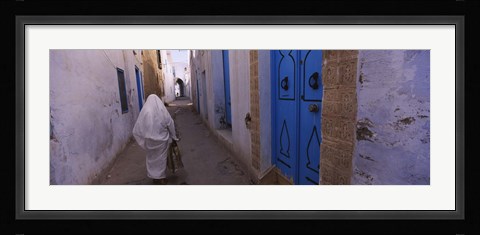 Framed Rear view of a woman walking on the street, Medina, Kairwan, Tunisia Print