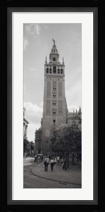 Framed Group of people walking near a church, La Giralda, Seville Cathedral, Seville, Seville Province, Andalusia, Spain Print