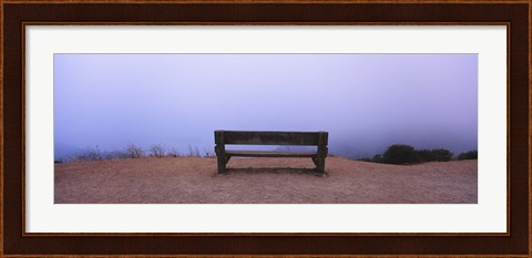 Framed Empty bench in a parking lot, California, USA Print