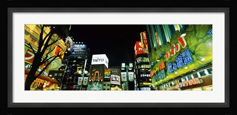 Framed Low angle view of buildings lit up at night, Shinjuku Ward, Tokyo Prefecture, Kanto Region, Japan Print