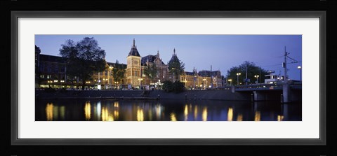 Framed Reflection of a railway station in water, Amsterdam Central Station, Amsterdam, Netherlands Print