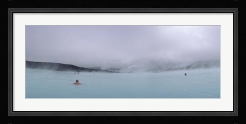 Framed Tourist swimming in a thermal pool, Blue Lagoon, Reykjanes Peninsula, Reykjavik, Iceland Print