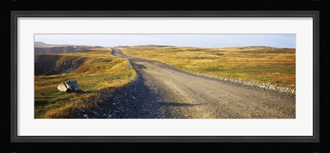 Framed Gravel road passing through a landscape, Cape Bonavista, Newfoundland, Newfoundland and Labrador, Canada Print