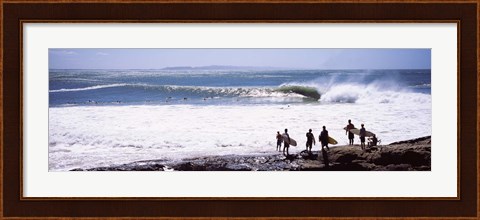 Framed Silhouette of surfers standing on the beach, Australia Print